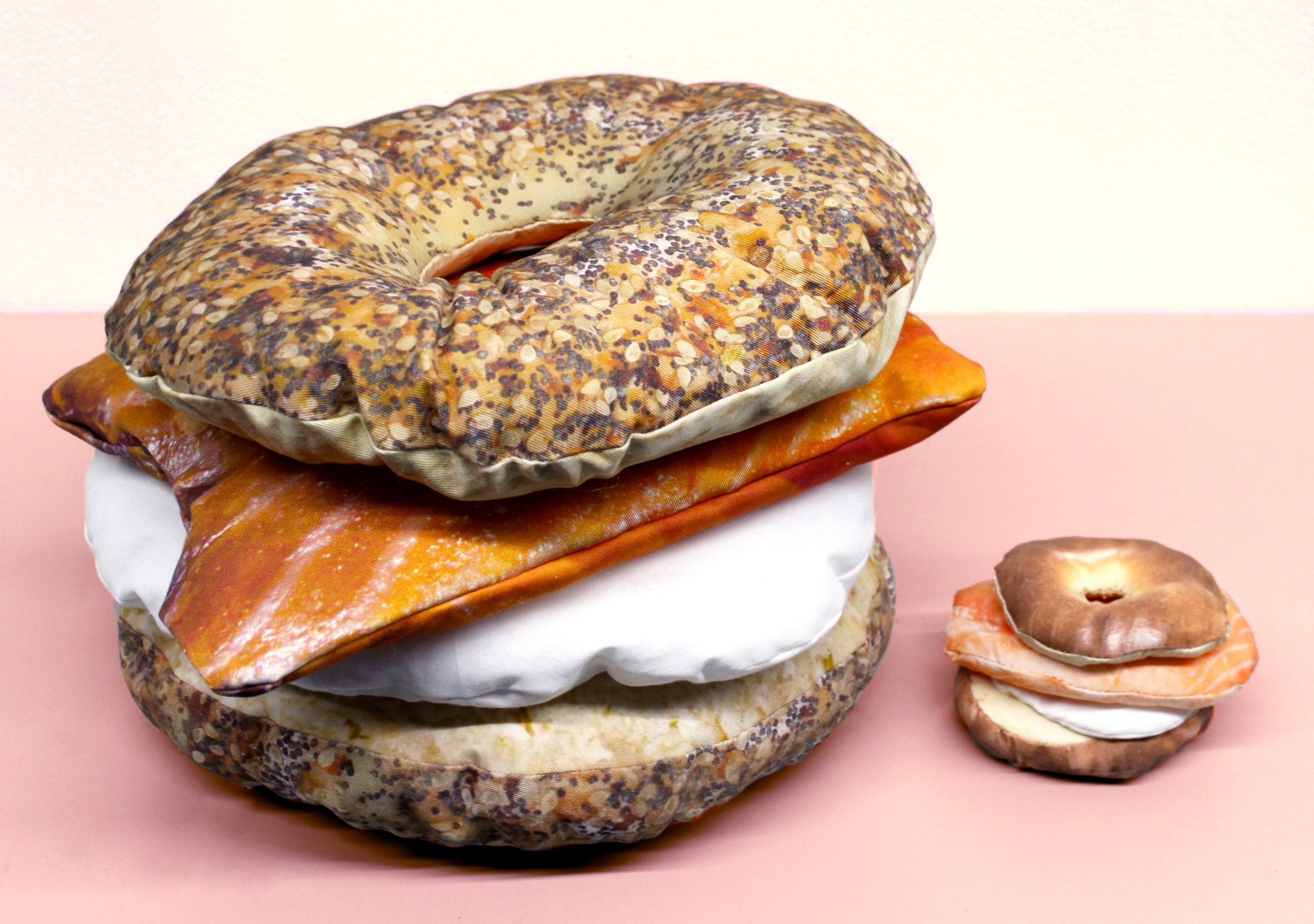 Artist: Samantha Polinsky Title: Everything Bagel and Son Medium: Printer ink on fabric, thread, stuffing Dimensions: 1.8’x1.8’, 5”x5” Website: https://sammypolinsky.cargo.site/