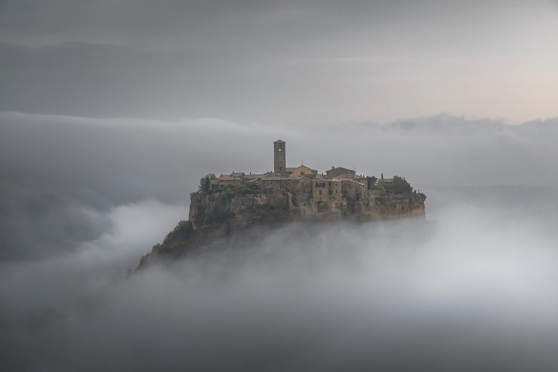 FLUFFY TOWN Stefano Caccia Photograph of a misty rocky mountain landscape