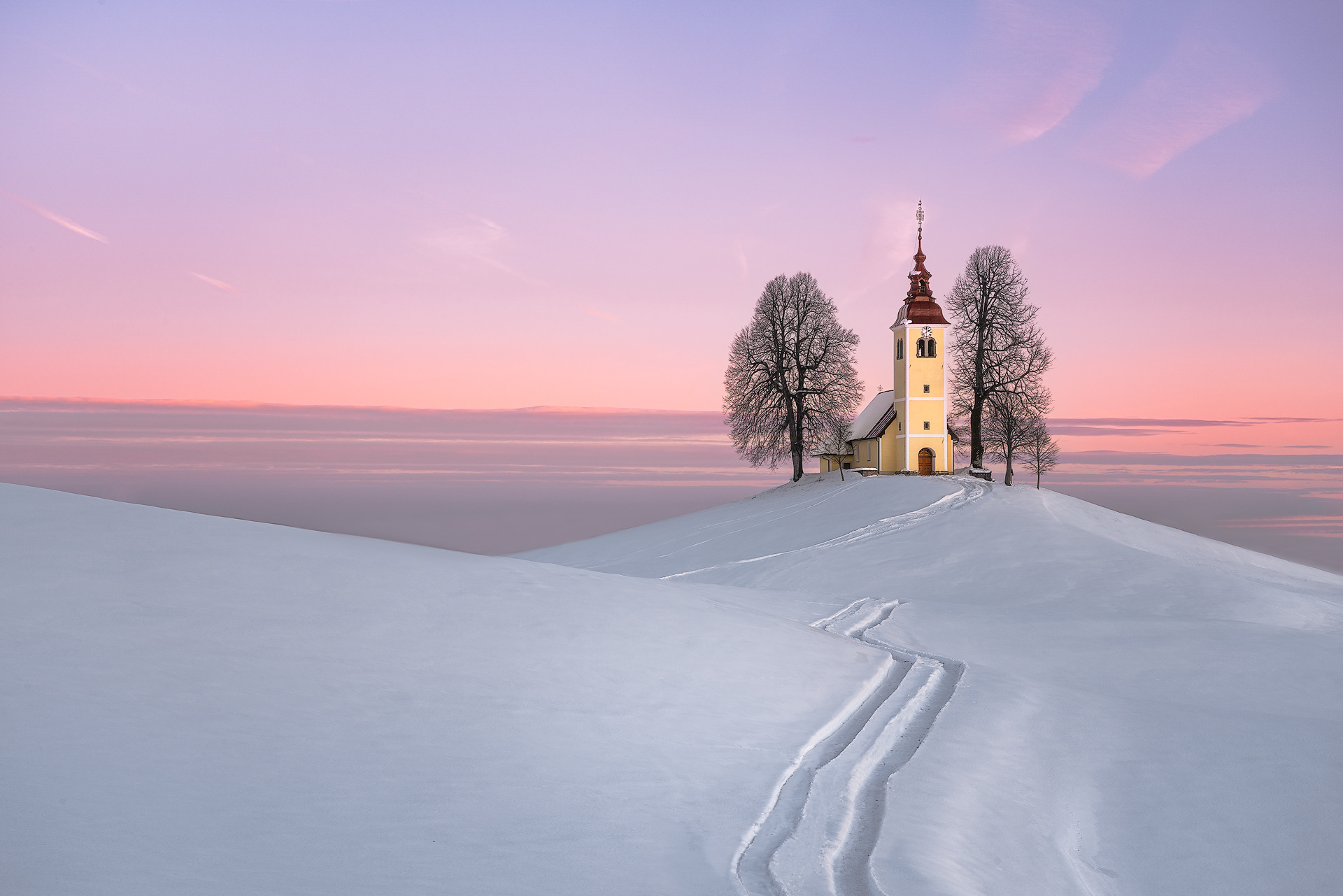 THE PATH Stefano Caccia photograph of a snow covered path leading to a church.