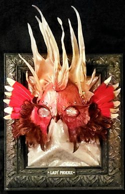 Lady Phoenix, Mixed media: leather, found metal objects, acrylic paint, feathers, and glass. - www.scrappersleatherpatchhandcraftedstudio.art Lisa Boozer - Lady Phoenix, Mixed media: leather, found metal objects, acrylic paint, feathers, and glass.