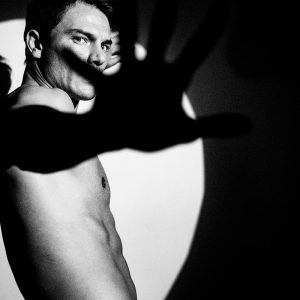 Digital Photo - Male model in studio and hand to camera - http://www.edwardolive.info/ Edward Olive - Digital Photo - Male model in studio and hand to camera